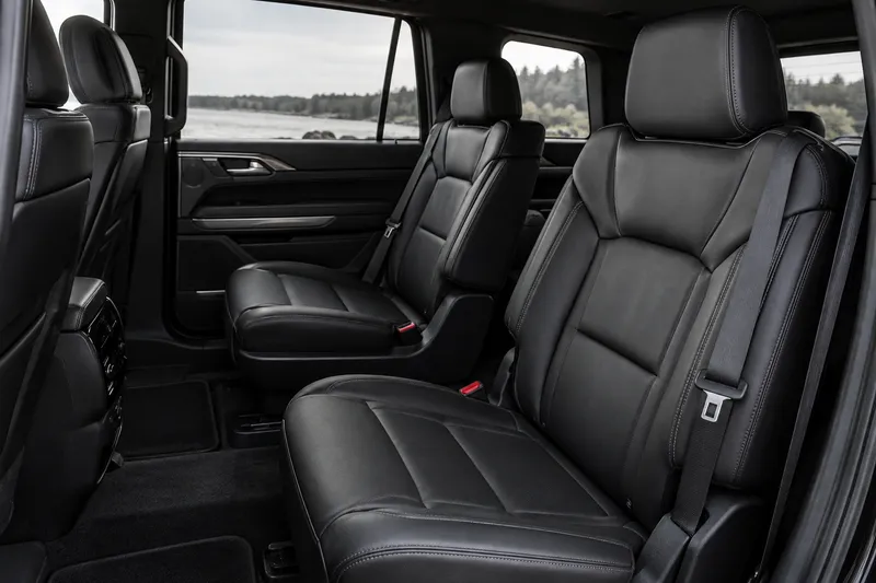 Black leather seats in a softly lit SUV cabin